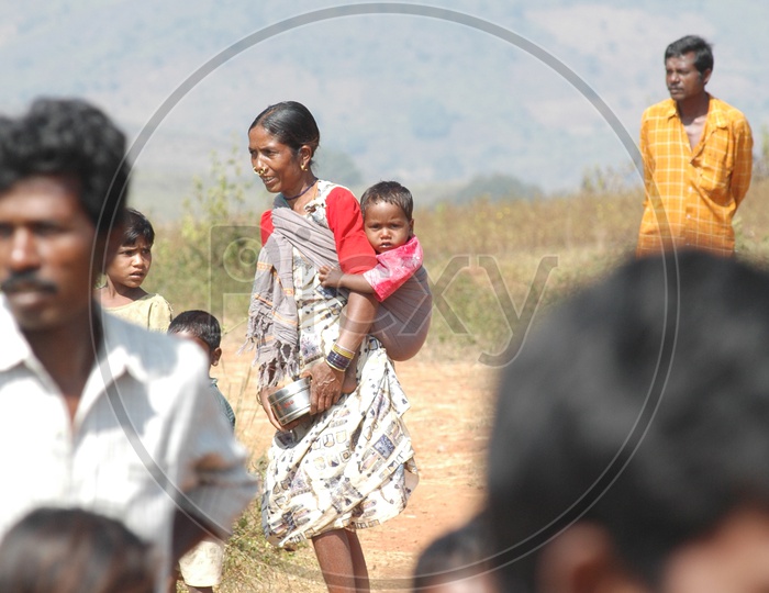 Tribal Mother Carrying Child on Her Back