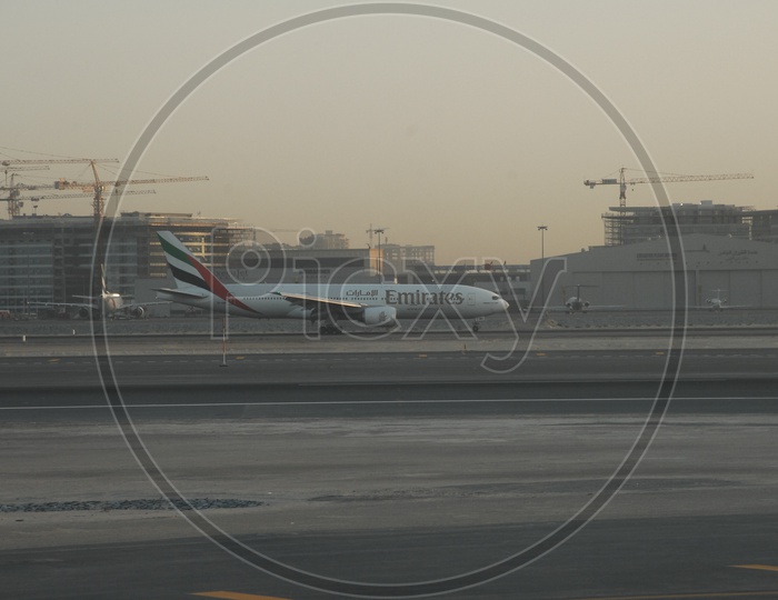 Emirates flight moving on Runway in Dubai Airport