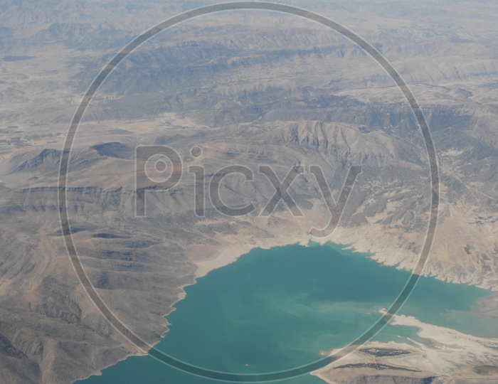 Aerial view of Mountains in USA with small water pond
