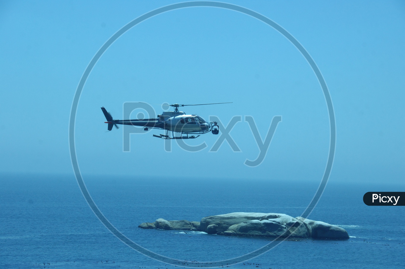 Helicopter flying over the sea