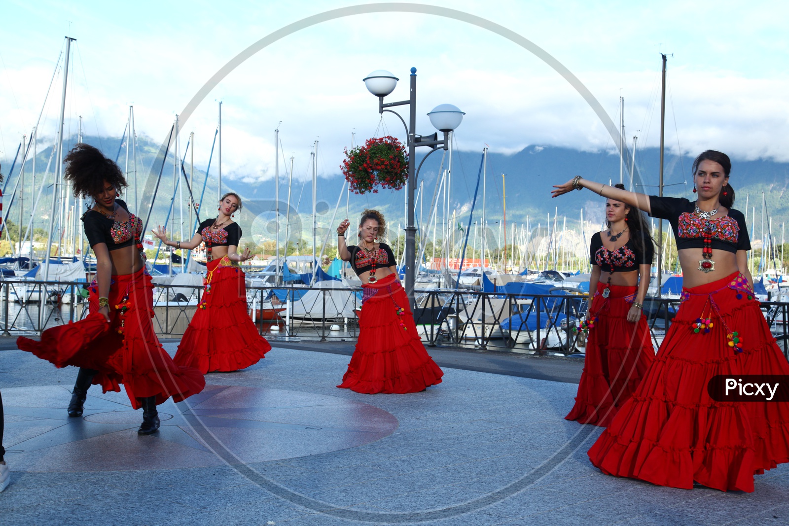 Women dancing at the harbor