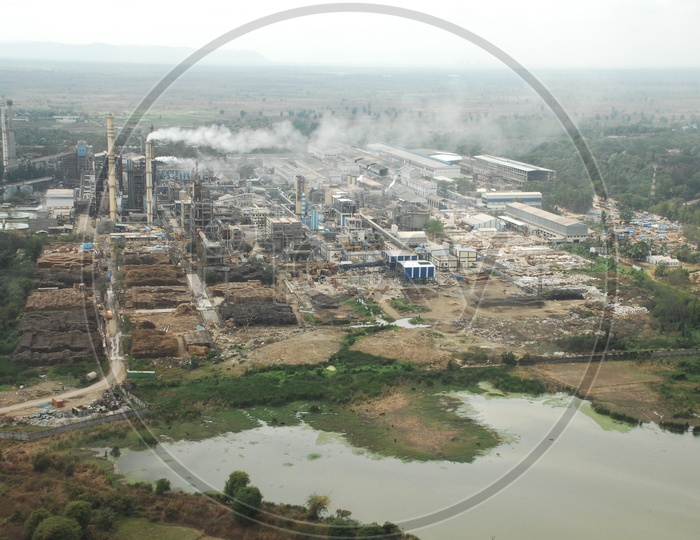 An Aerial View Of Industrial area in hyderabad  with Godown and houses  from Flight Window