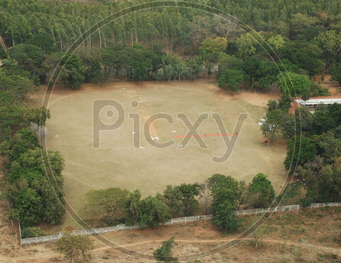 An Aerial View Of a Helipad Marking in a Ground