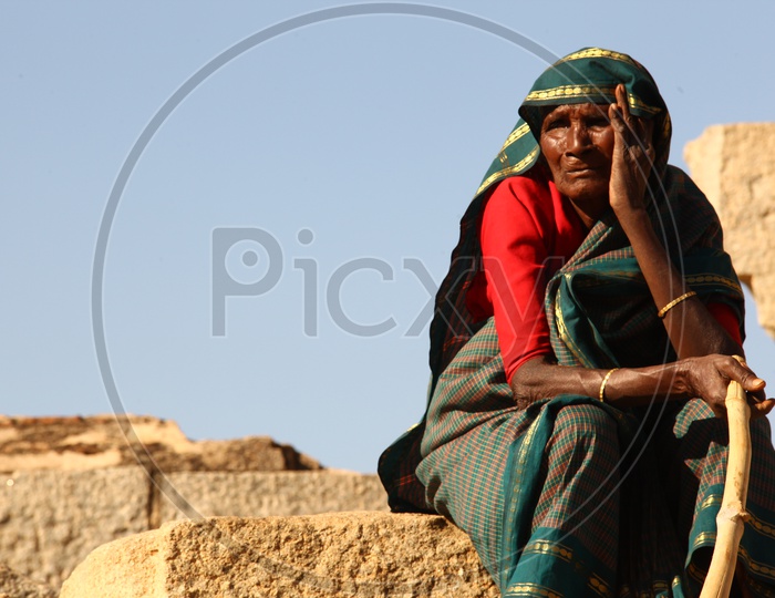 An old Indian woman at a temple
