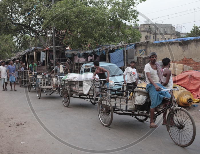 Men pedaling the rickshaw