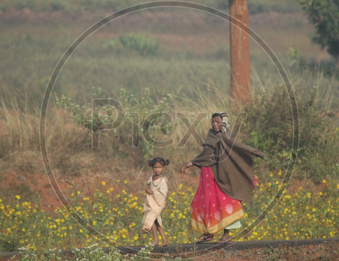 A Mother With a Girl Child in Farm Field in araku