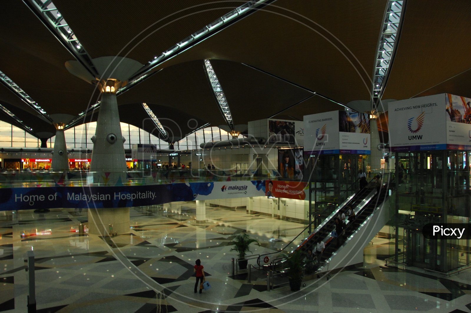 Interior Views of Kuala Lumpur Airport With Infra Structure and Passengers Travel Scenes