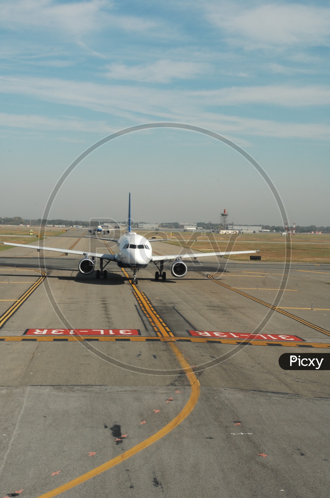 JetBlue flight moving on Runway