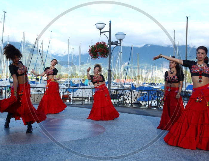 Women dancing at the harbor