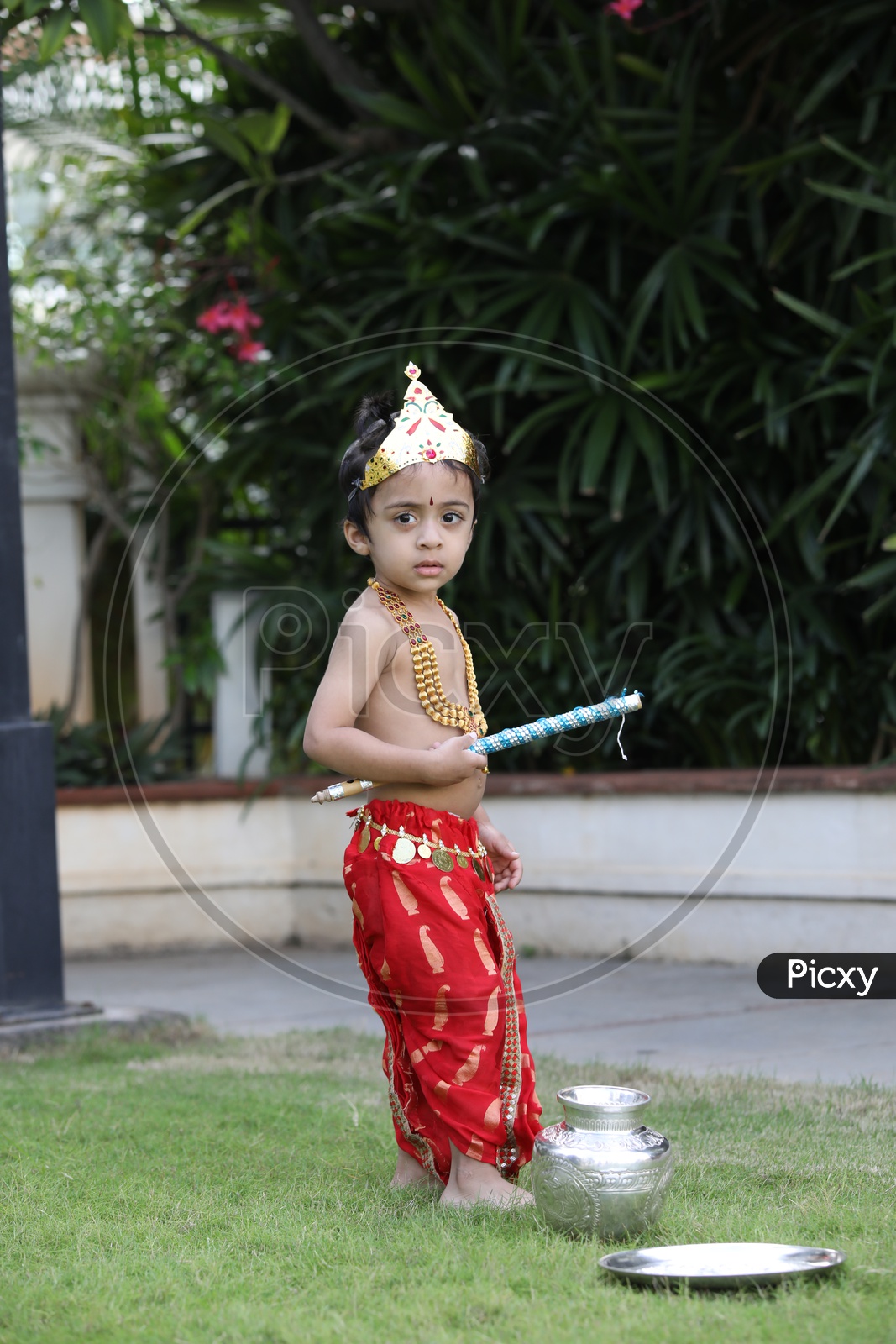 Little boy dressed up as Lord Krishna