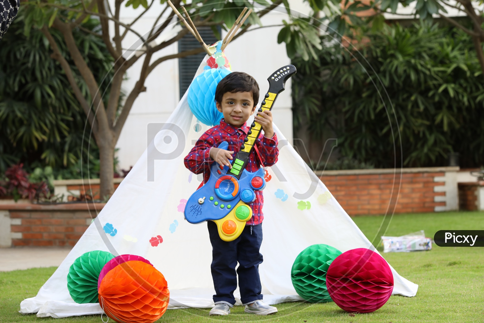 Little boy Playing toy guitar