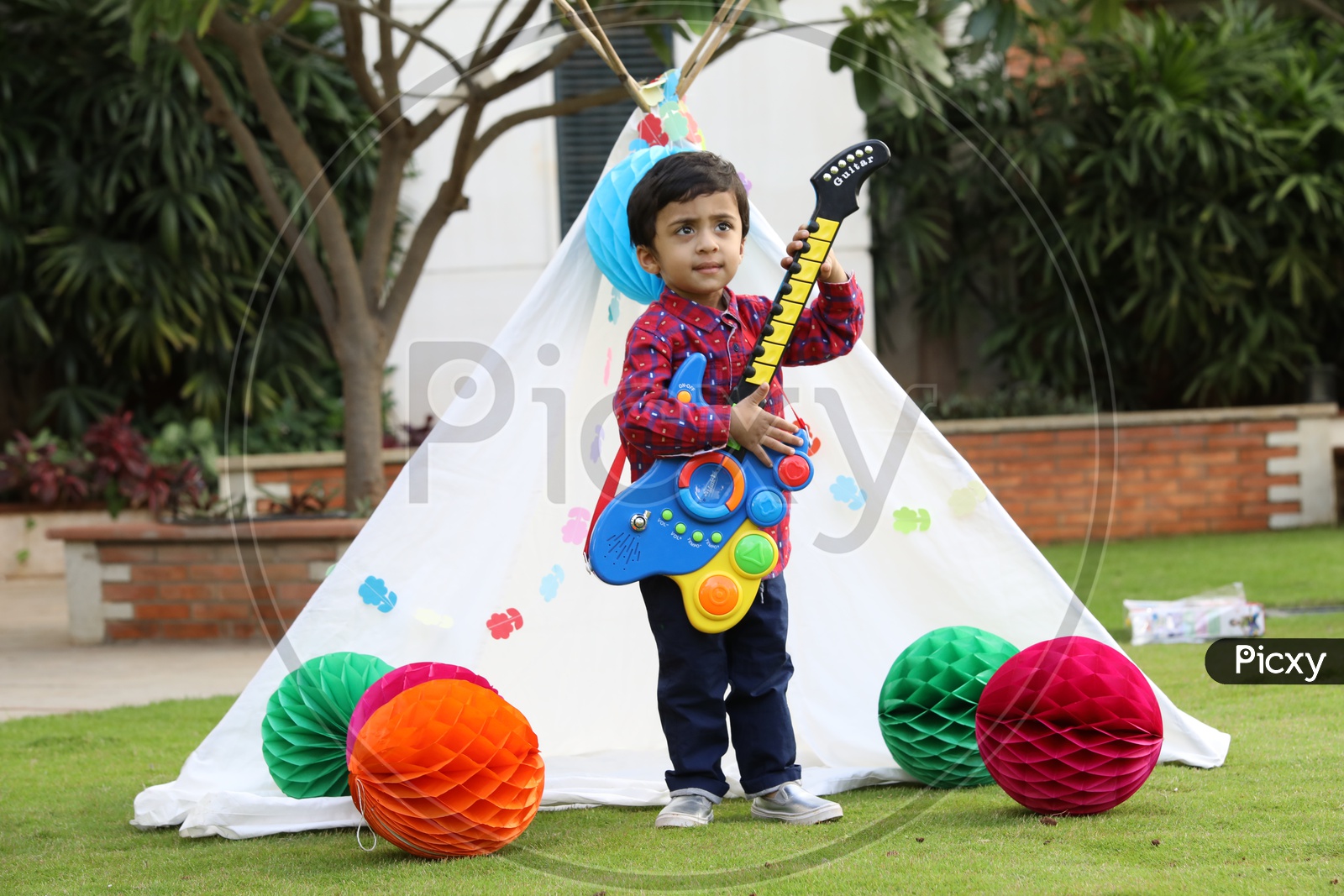 Little boy Playing toy guitar