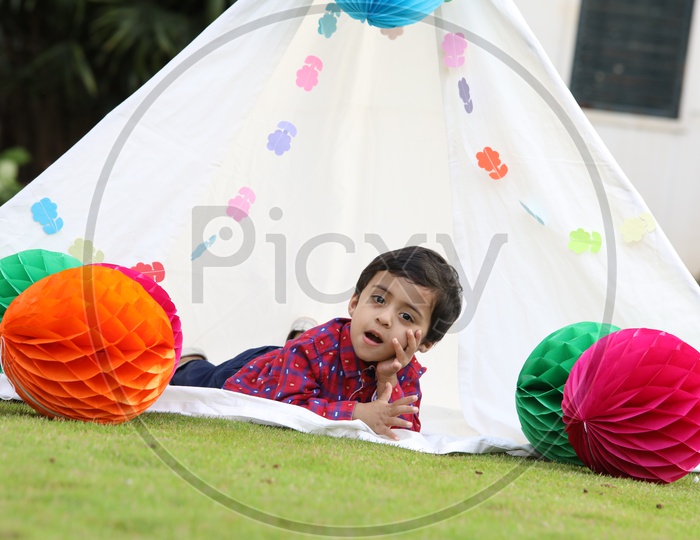 Little boy in a white tent