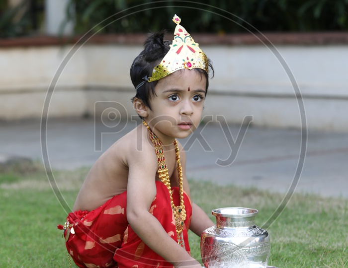 Little boy dressed up as Lord Krishna