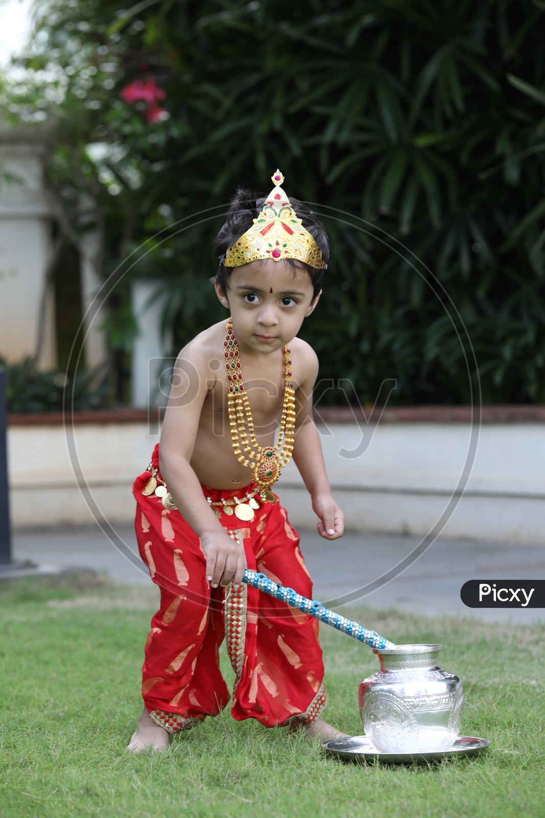 Little boy dressed up as Lord Krishna