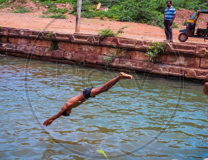 Village lads swimming near Mahakoota