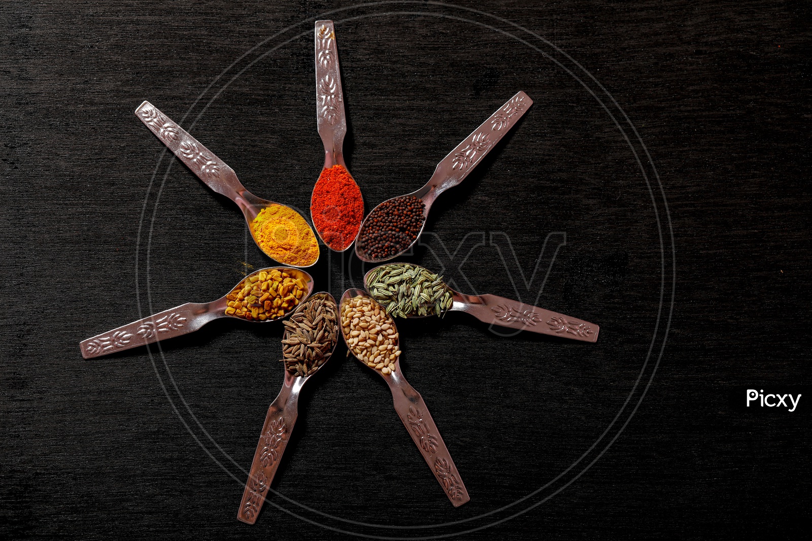 Various Indian Spices In Spoon On an Black Background