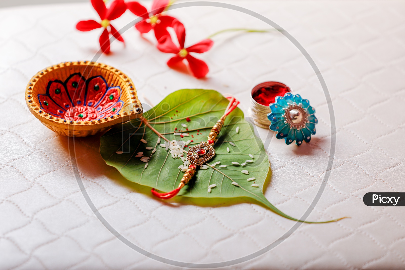 Rakhi on betel leaf with Diya - Indian Festival traditions/rituals