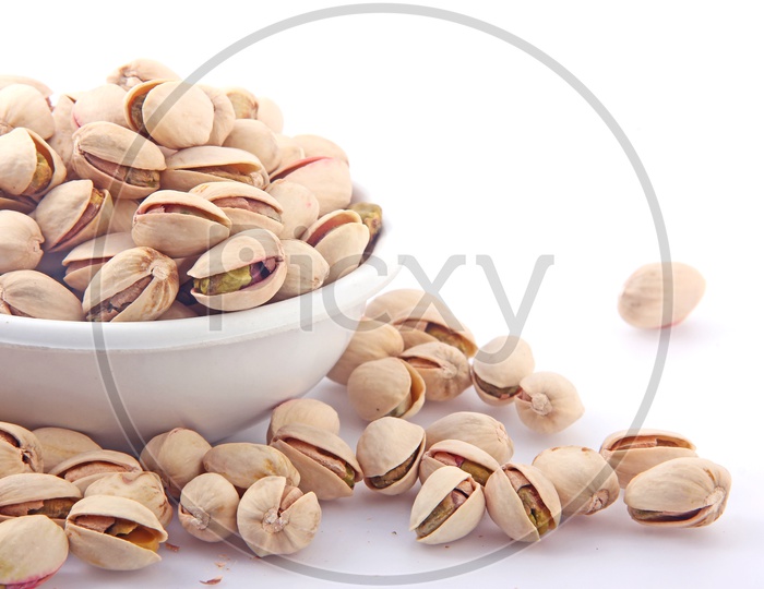 Pistachios in Bowl on a Isolated whitw Background