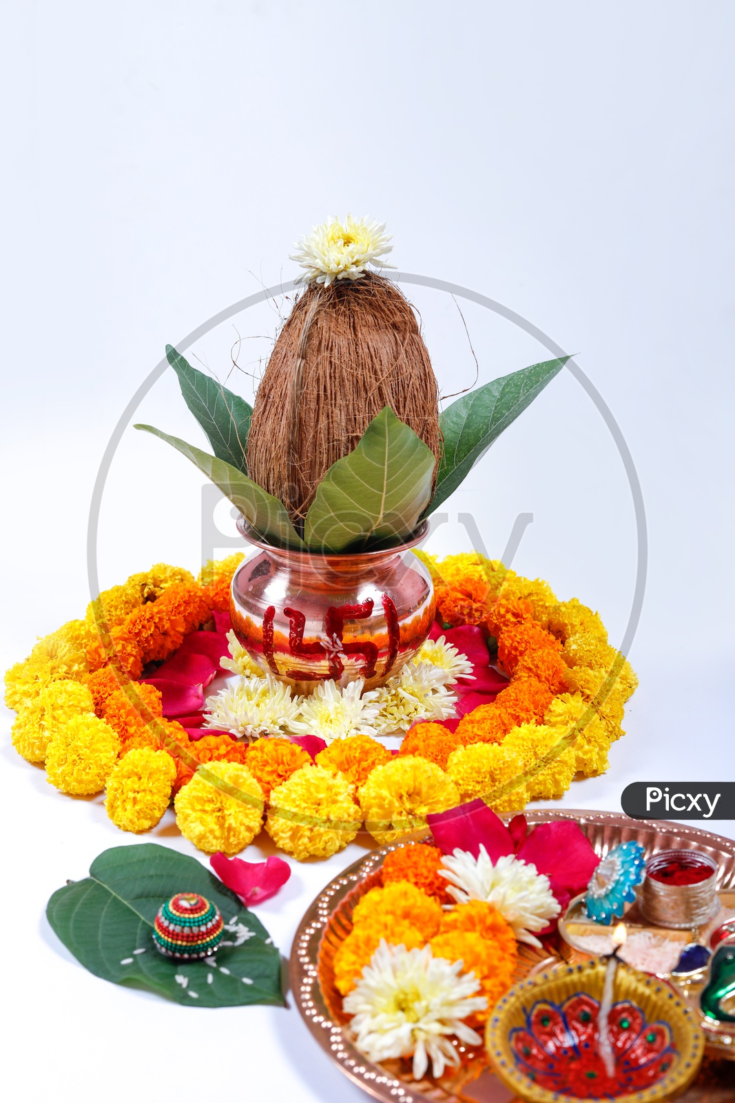 Kalisam decorated with Marigold Flower for Pooja & Thalli. Indian traditions/rituals