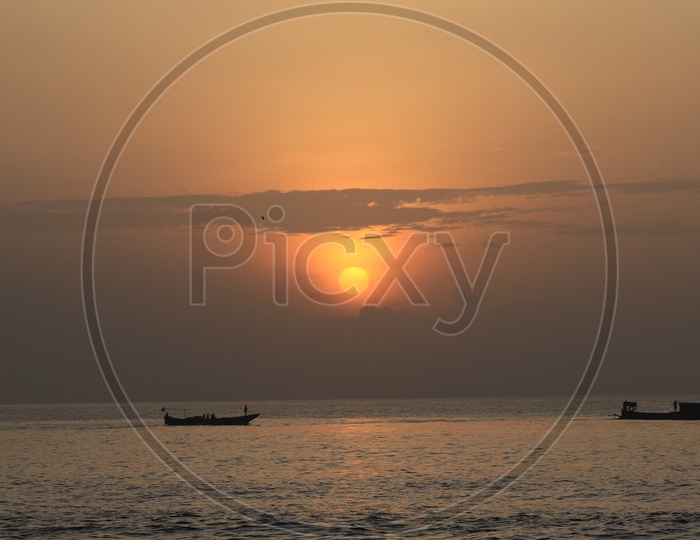 Sunset/Sunrise with boats along the Bay of Bengal Sea