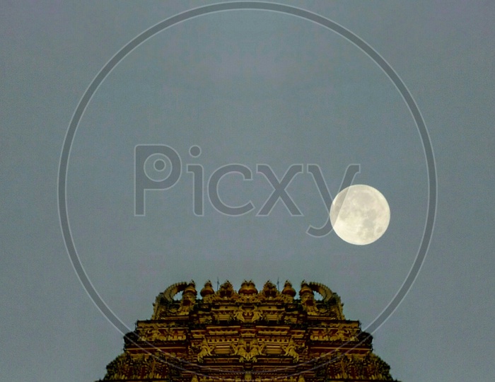 Mysore temple Gopuram with a Full moon in the background