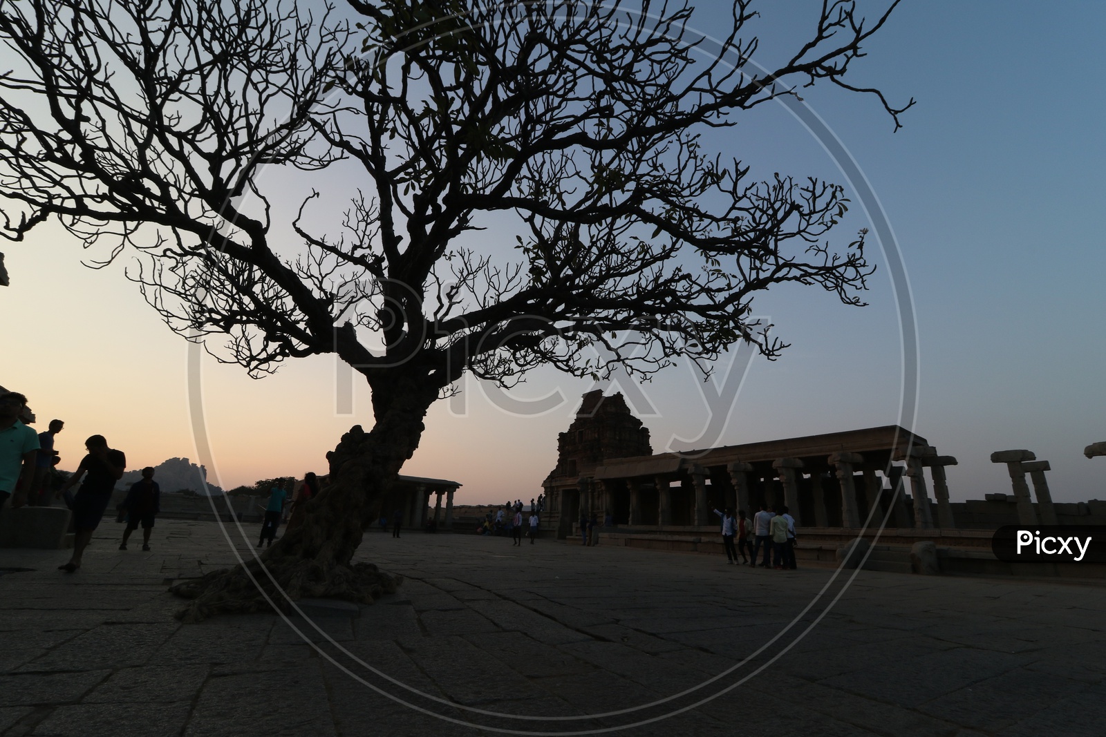 Silhouette of Vittala Temple and Tourists in Hampi , Karnataka