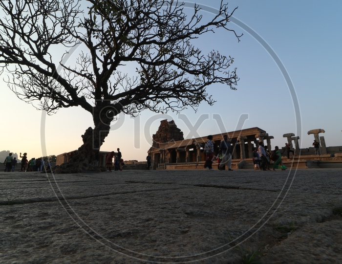 Silhouette of Vittala Temple and Tourists in Hampi , Karnataka