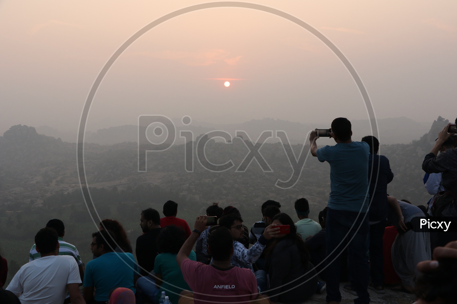 Visitors / Tourists Watching Sunset on Rock hills Of Hampi