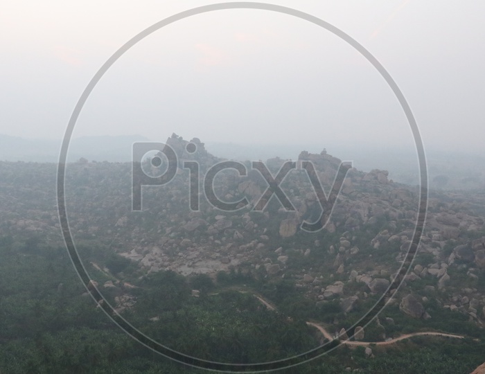 Aerial View Of Old Ruins Of hampi temple With Rock hill Chain in Hampi , Karnataka