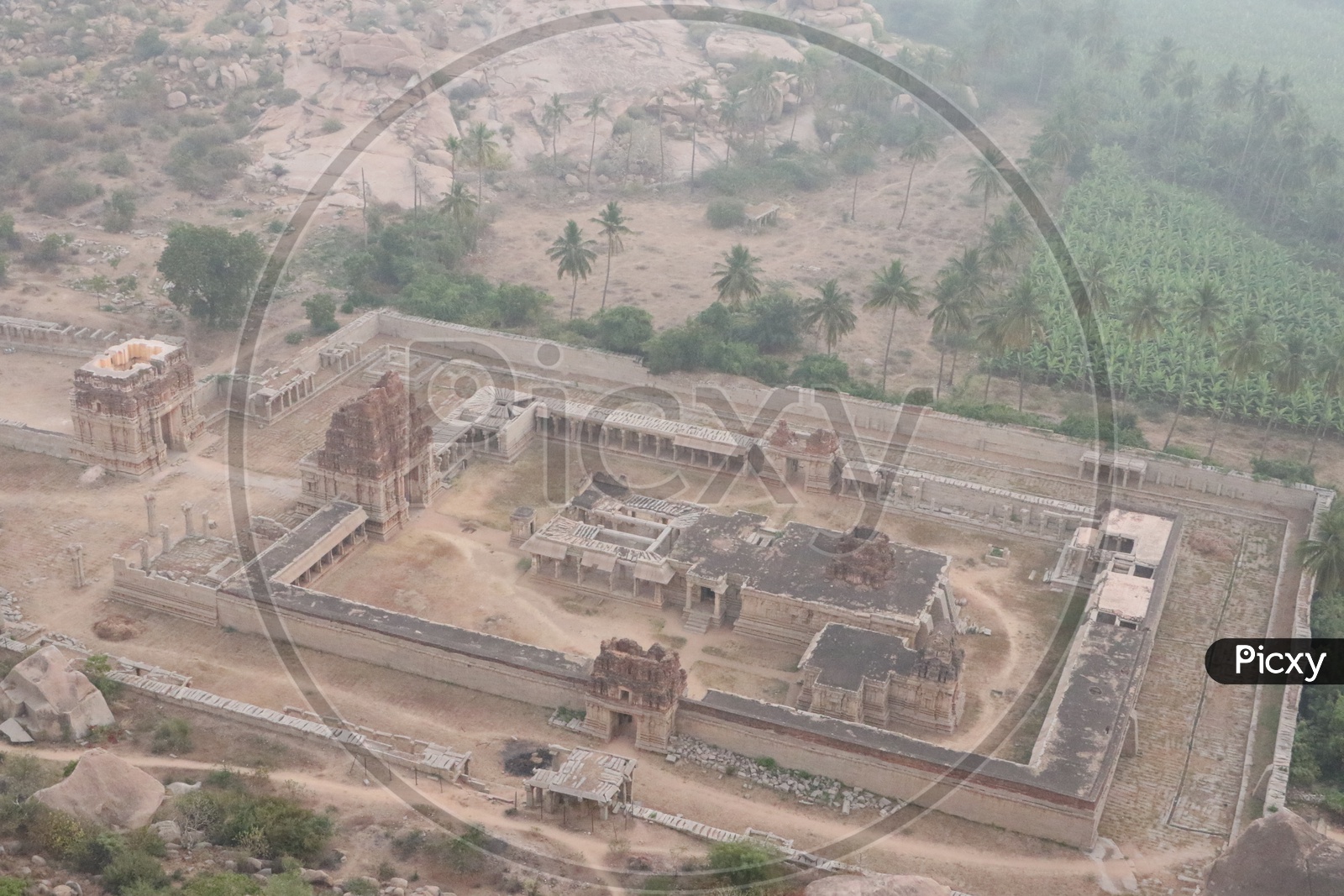 Aerial View Of Old Ruins Of hampi temple With Rock hill Chain in Hampi , Karnataka