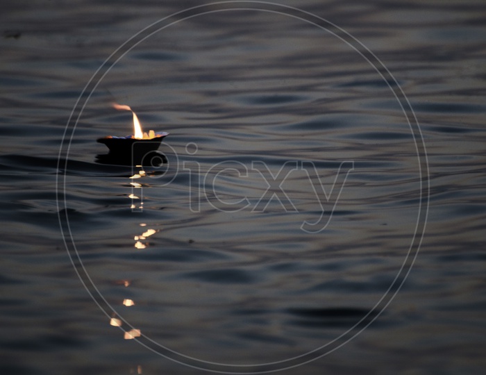 diya floating in Ganga River