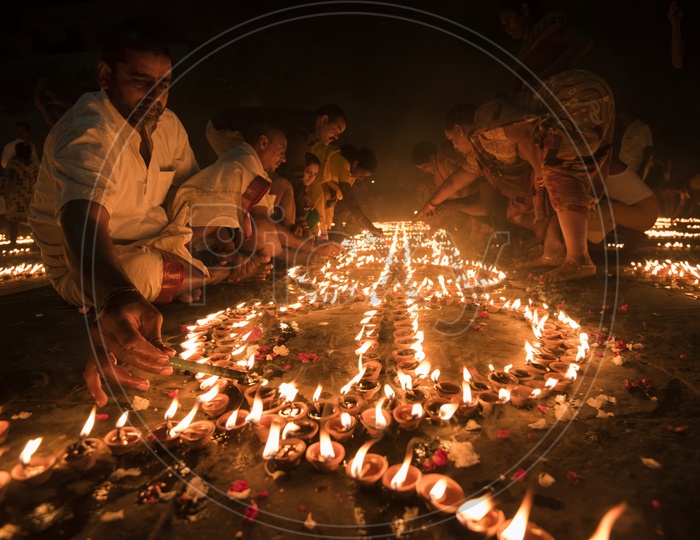 Indian hindu Devotees  Lighting the Dias in River Bank of ganga River In varanasi