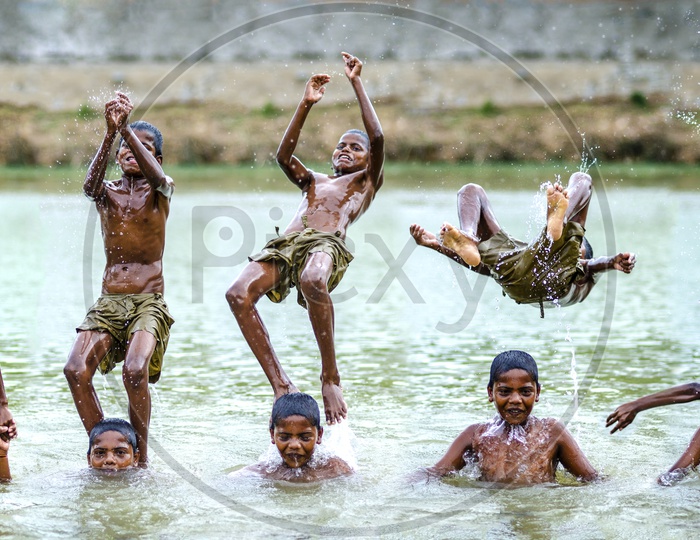 Village Kids swimming in local lake