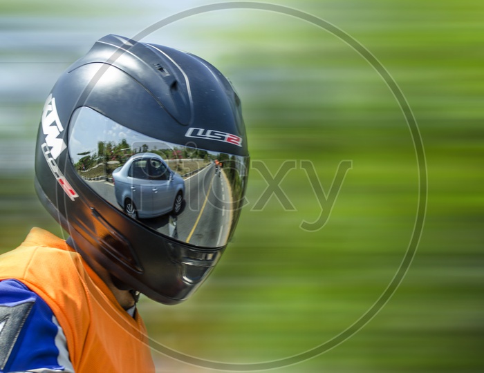 Bike rider with Helmet Panning Shot