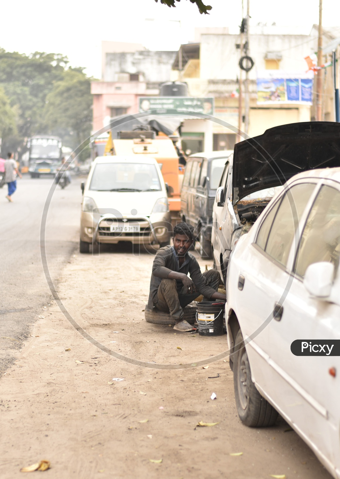 An Indian Mechanic Working On a Road Side