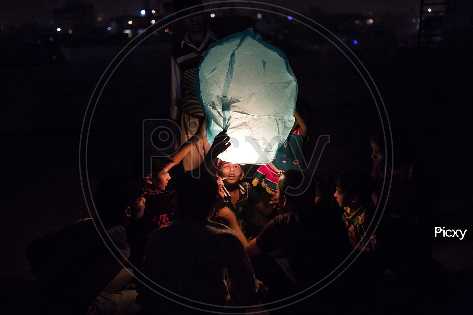 Indian Children Flying a Sky Lanterns in Gujarat in a Festival