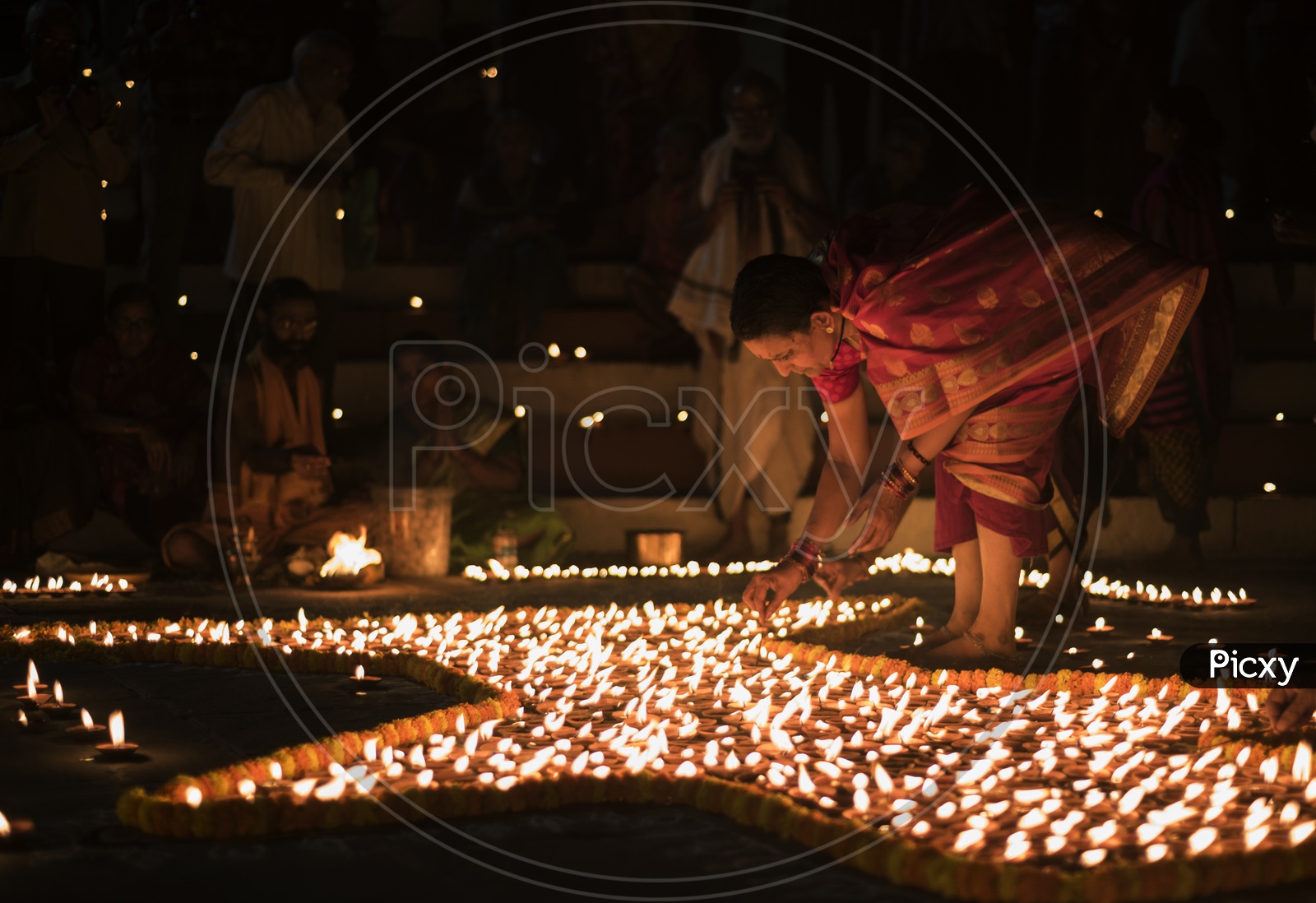 Indian hindu Devotees  Lighting the Dias in River Bank of ganga River In varanasi