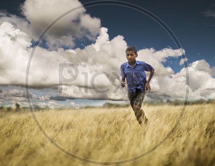 Boy running in a field