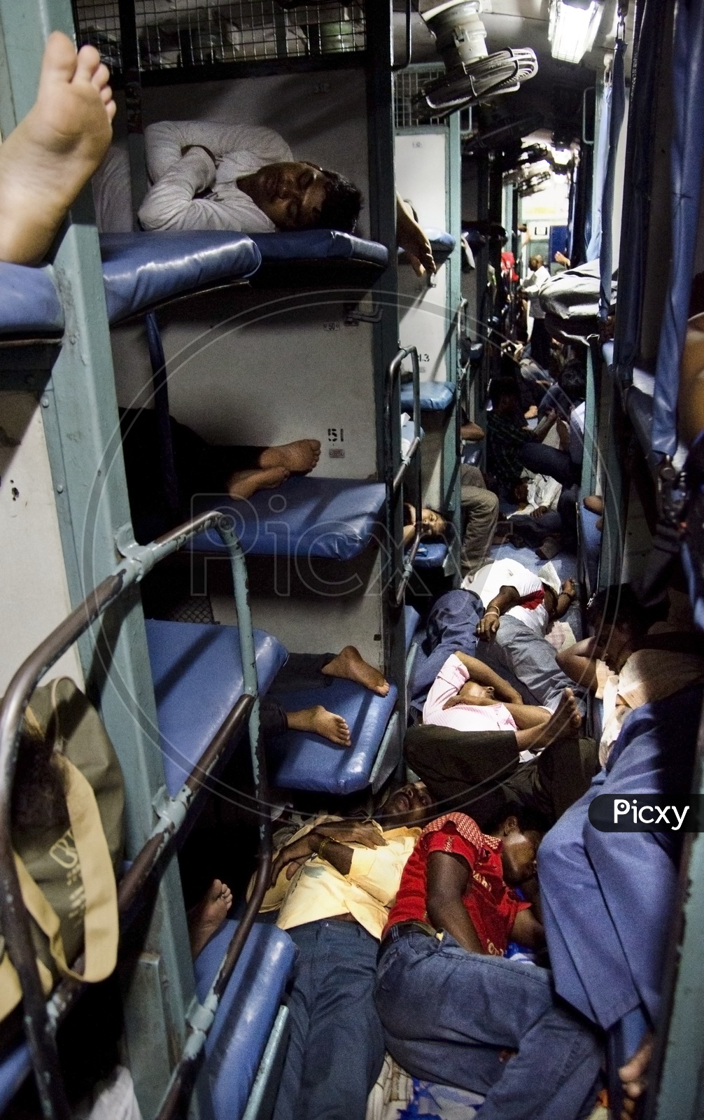 Passengers sleeping congested in a Train