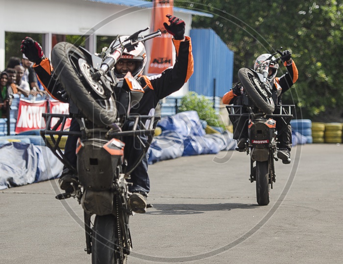 Bikers Performing Stunts at Orange Day KTM Event in Chennai