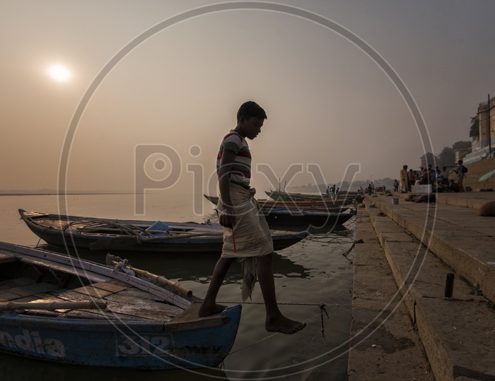 A Fisher man With his Catch of Fish in varanasi