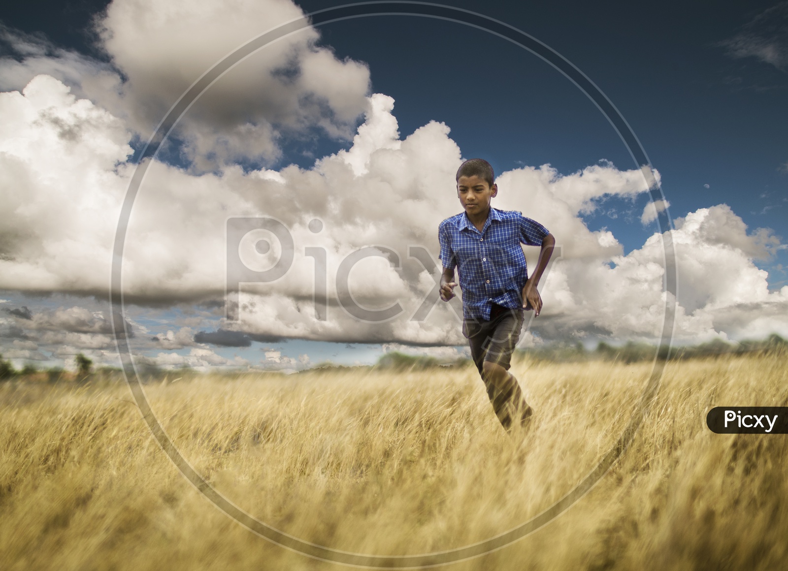 Boy running in a field