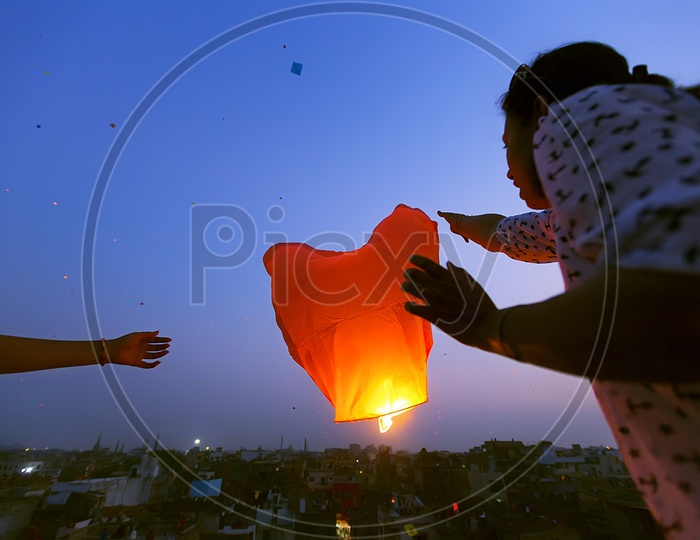 Indians Flying The Sky lanterns In kites and Lights Festival in Gujarat