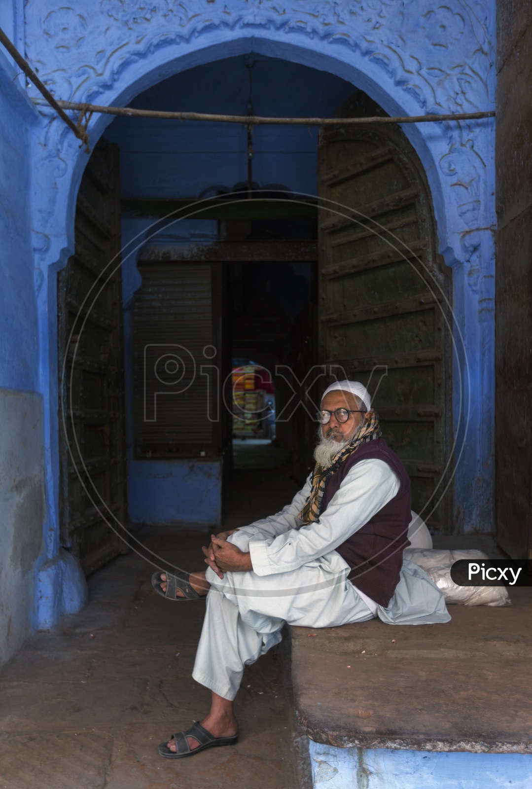 An Indian Old man Sitting on a Streets of Jodhpur