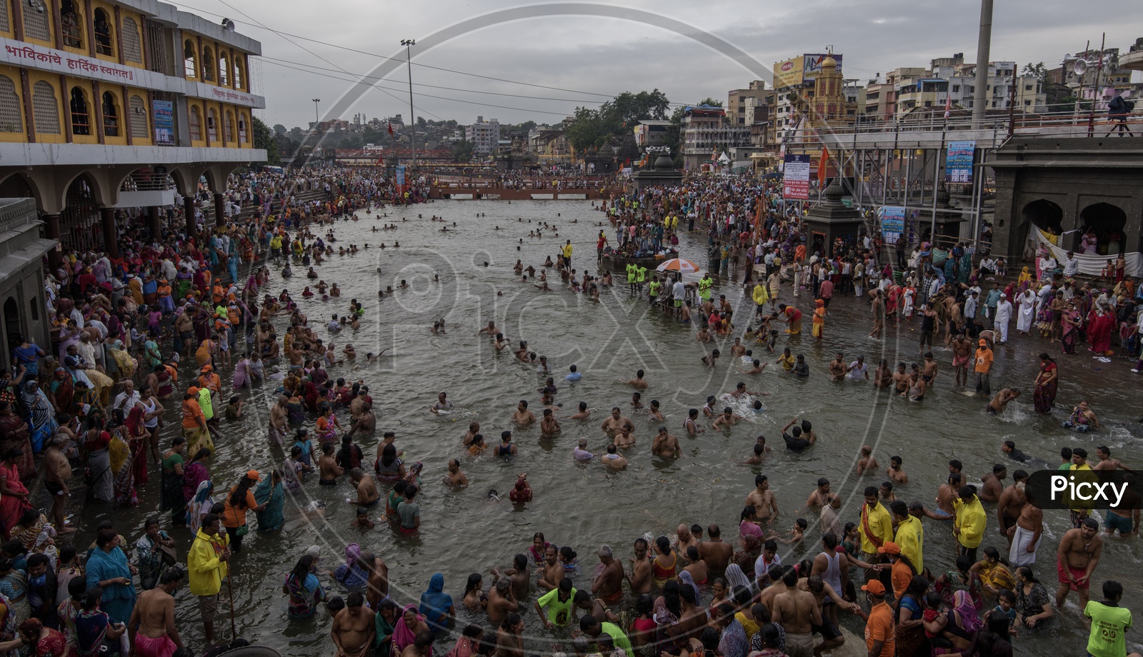 Devotees taking bath in the river at Nasik