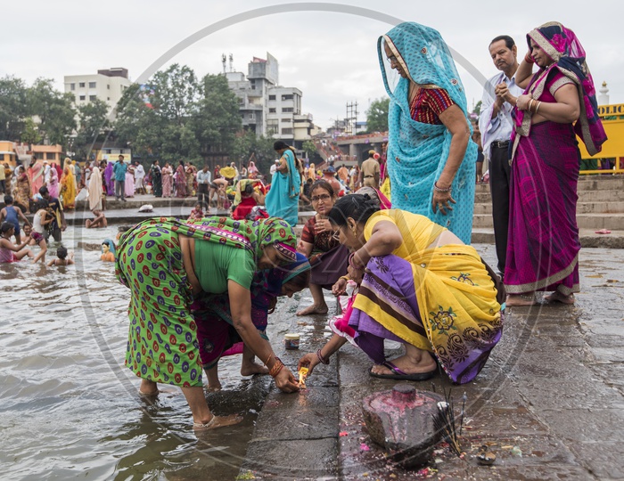 Indian Hindu Woman Devotees Paying Holy Prayers For River Godavari  in Nasik