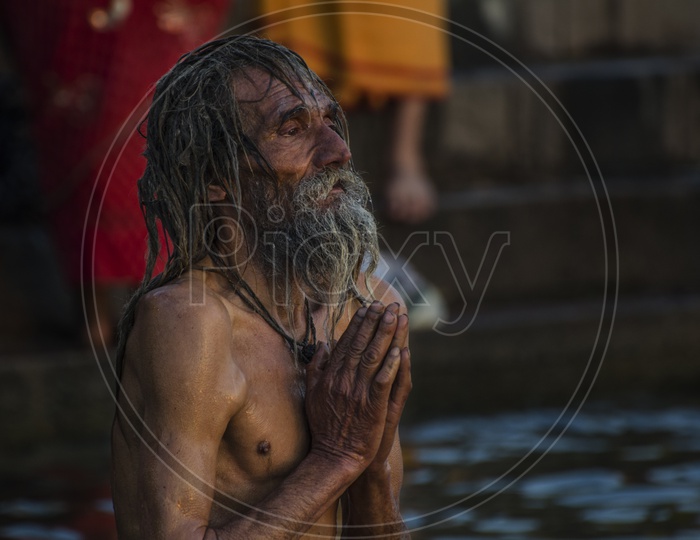 Sadhu doing surya namaskar in Varanasi