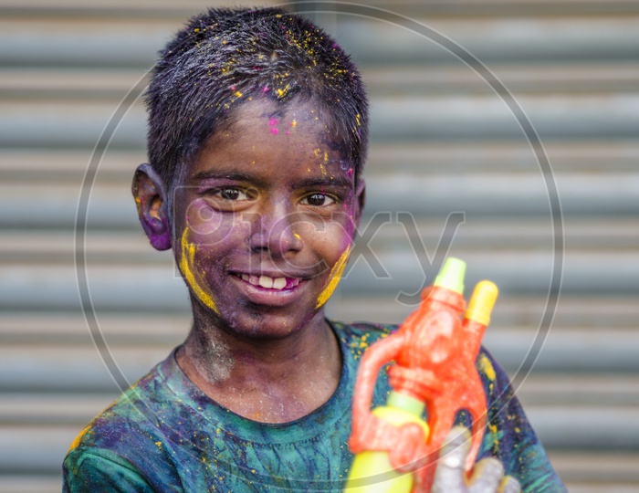 People celebrating  Holi festival in chennai / People with coloured face