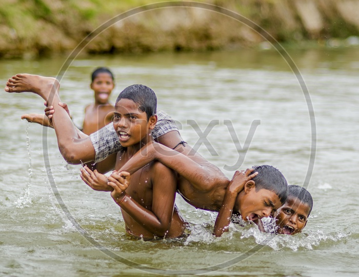 Village Kids swimming in local lake